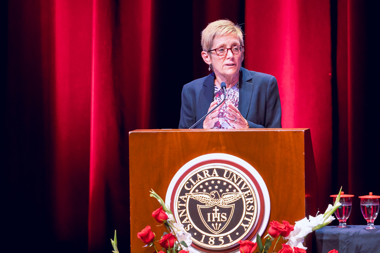 SCU President Sullivan speaking on stage at Mayer Theatre