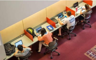 students sitting in study cubbies in the SCU library 