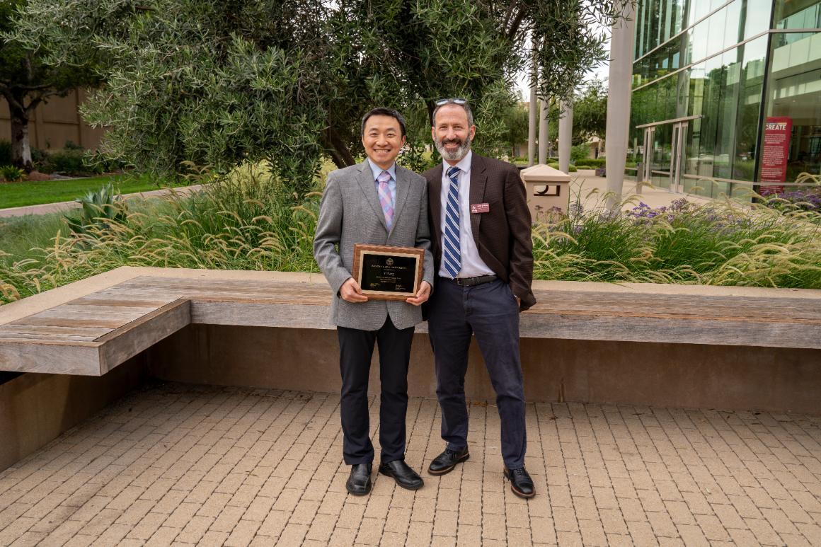 Yi Fang and Jim Glaser posing for a picture