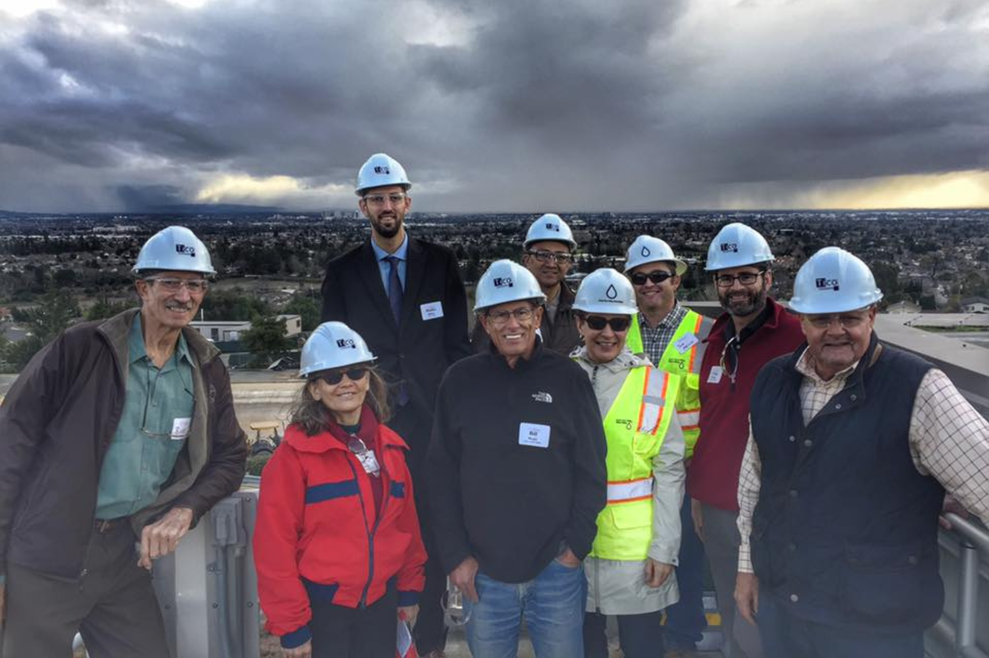 Group of people wearing construction hats 