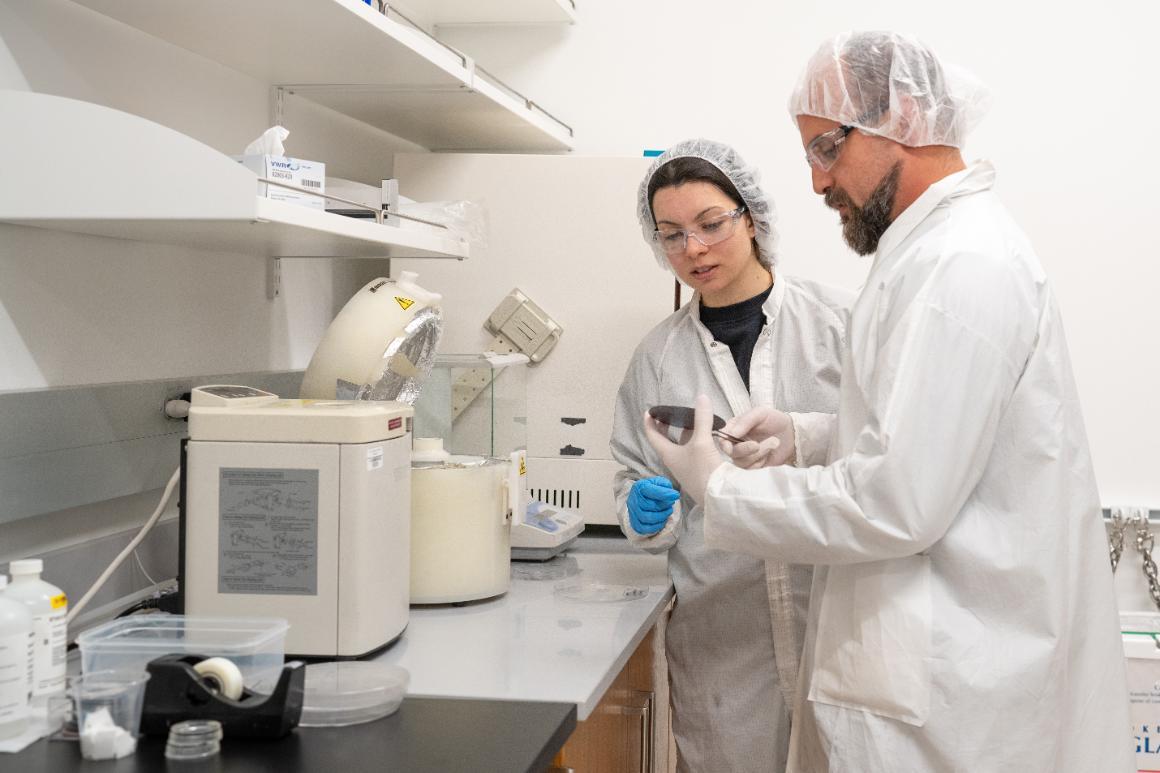 Woman bioengineering graduate student works side-by-side with faculty in the bioengineering lab.