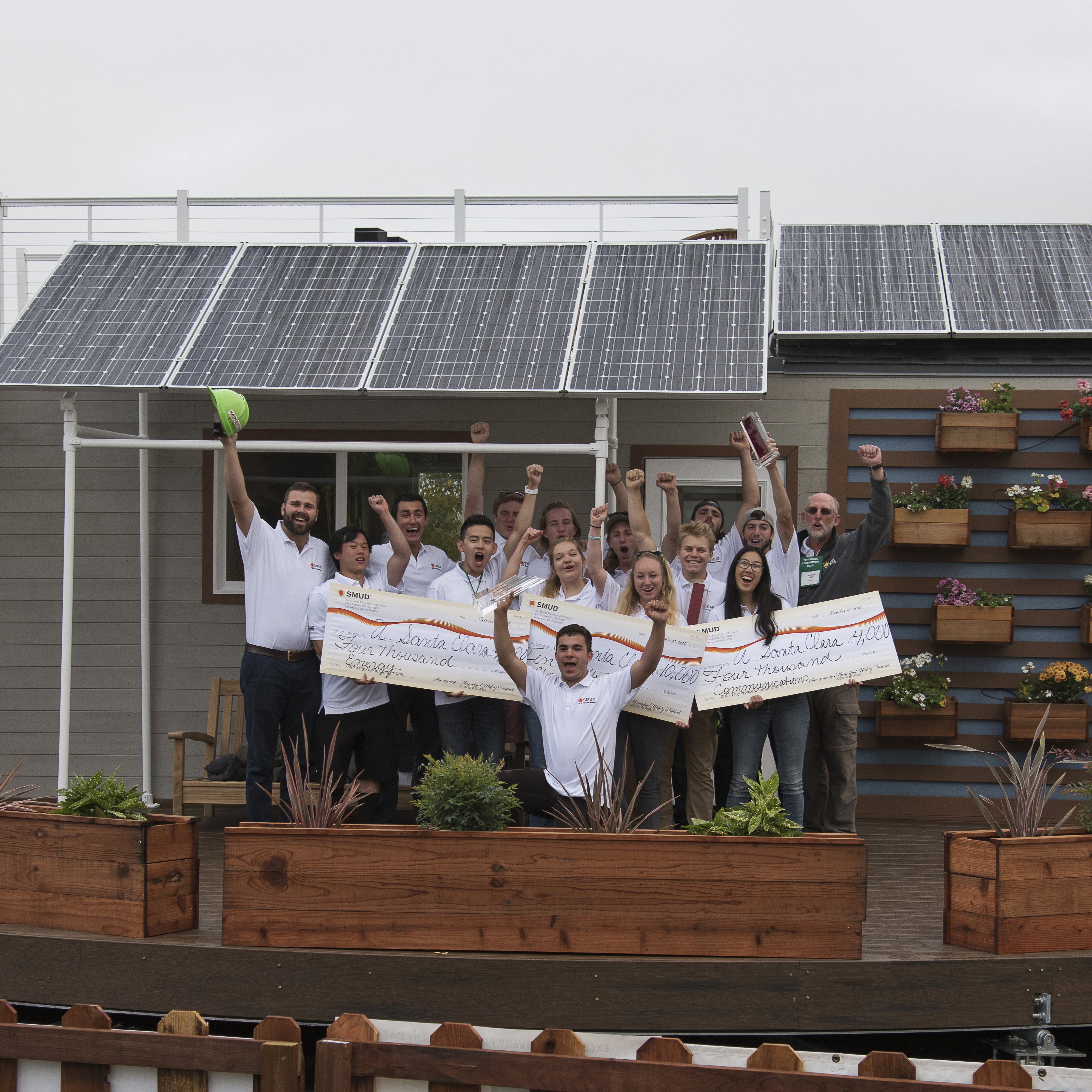 SCU's 2016 Tiny House team celebrates their victory in front of rEvolve House image link to story