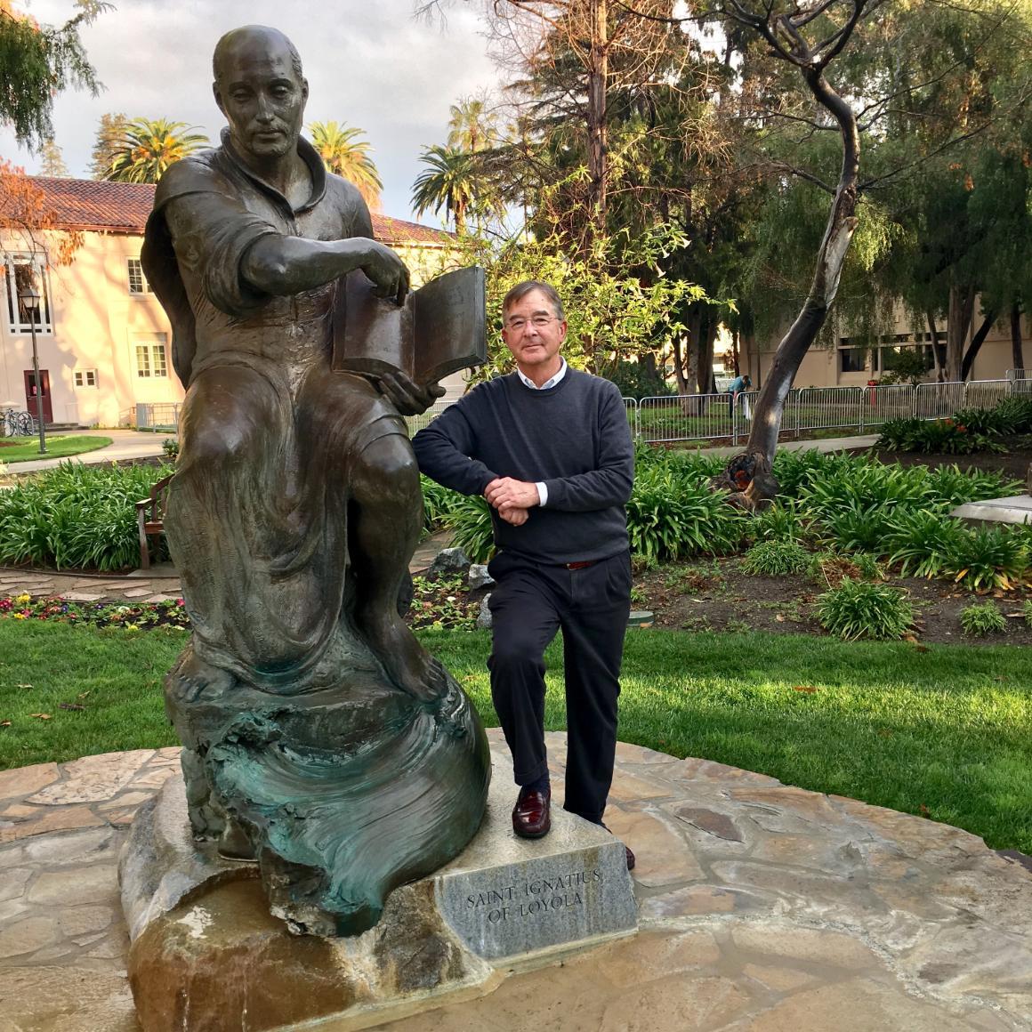 Lanny Vincent with SCU's statue of St. Ignatius