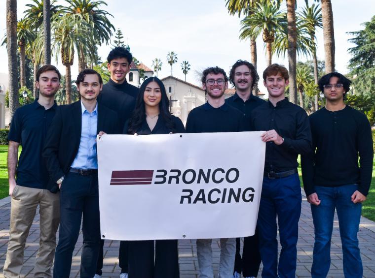 A picture of the Formula SAE Leads holding the 