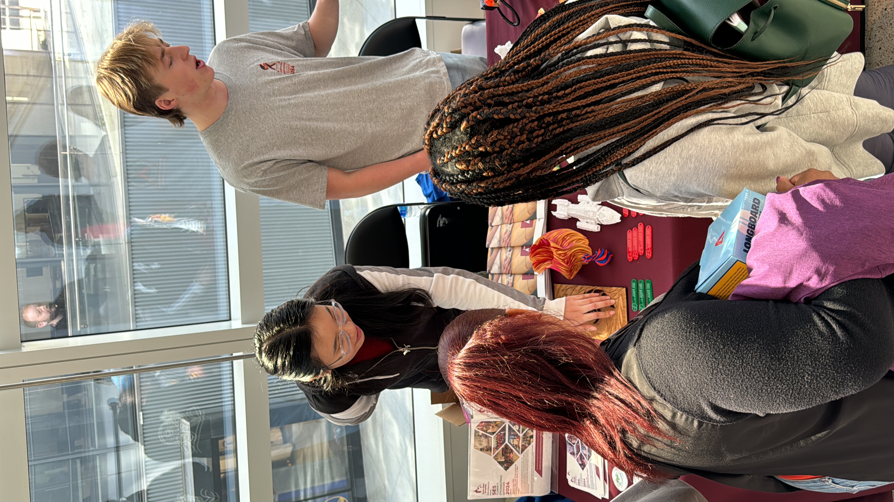 Maker Club at the 2024 STEAM Fest showing their creations.