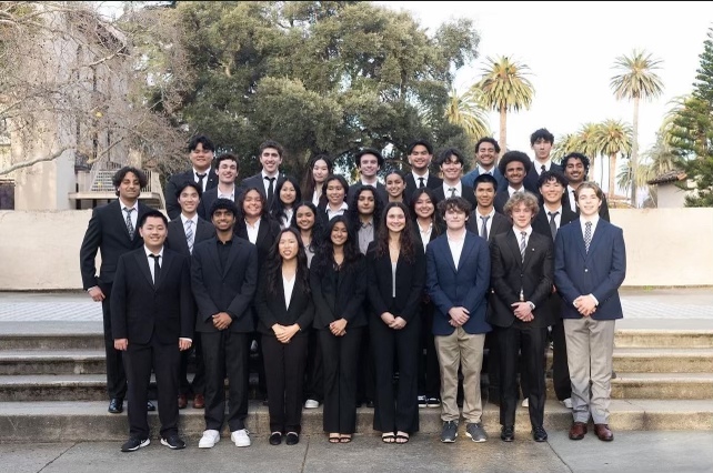 Group photo of Theta Tau members in professional attire.