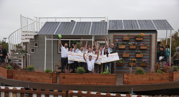 SCU's 2016 Tiny House team celebrates their victory in front of rEvolve House image link to story