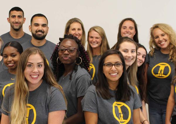 Students in NCIP t-shirts pose 