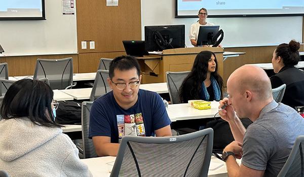 Students at a table in discussion 